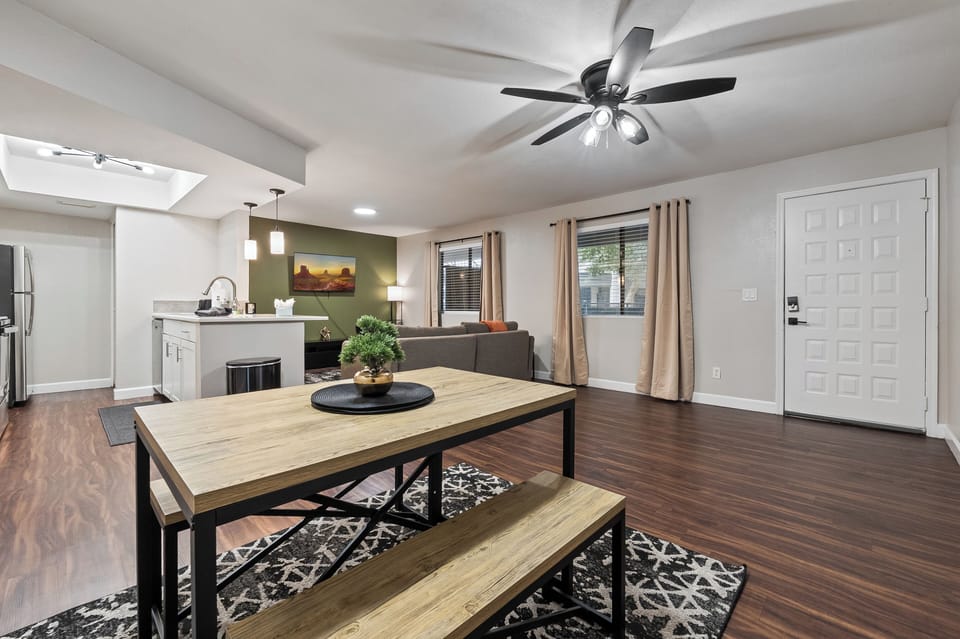 Comfortable dining easy access to living space with sofa, TV, and easy access to