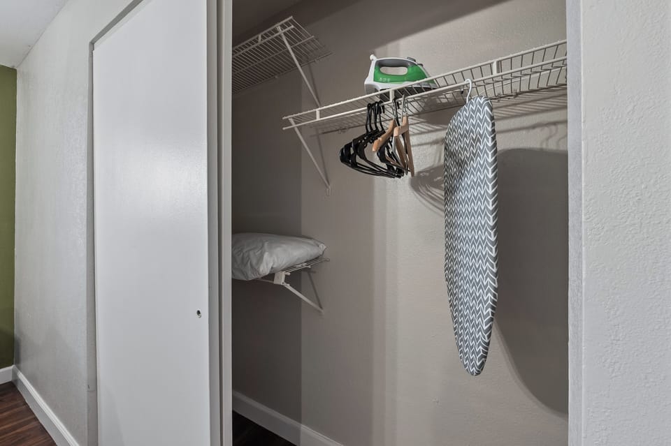 Iron and ironing board provided in unit
