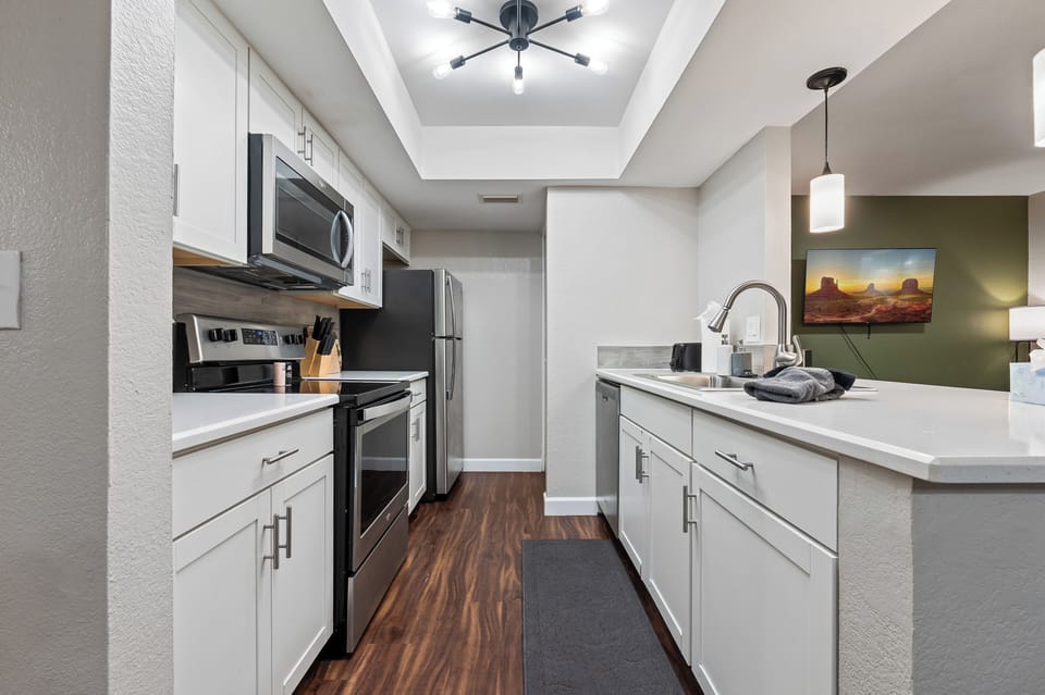 Modern kitchen with sink, dishwasher, and clean counter space