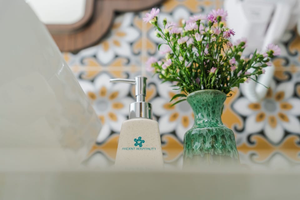 Separate tub and shower, rainfall showerhead, designer toiletries