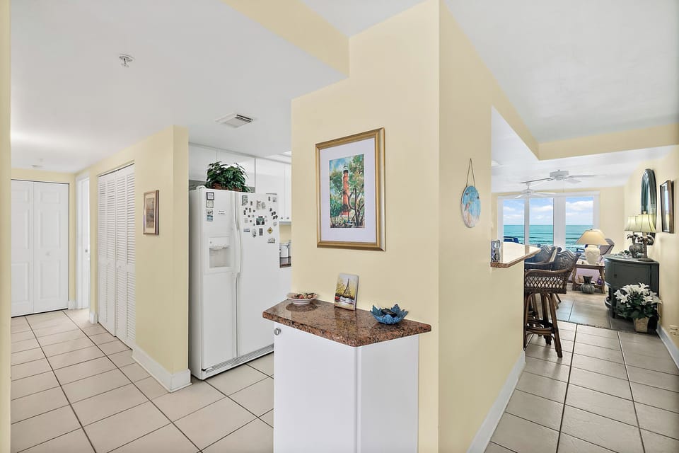 Hallway area, looking into the kitchen and living room