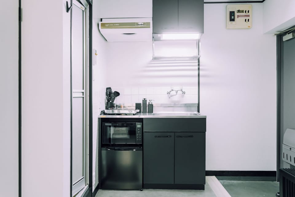 Apartment | Private kitchen | Mini-fridge, microwave, stovetop, cookware/dishes/utensils