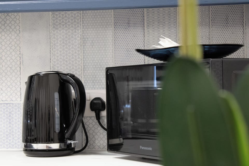 A practical yet stylish kitchen space designed to fit every part of your stay.