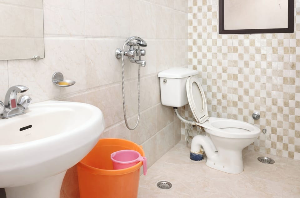 Shower, rainfall showerhead, slippers, towels
