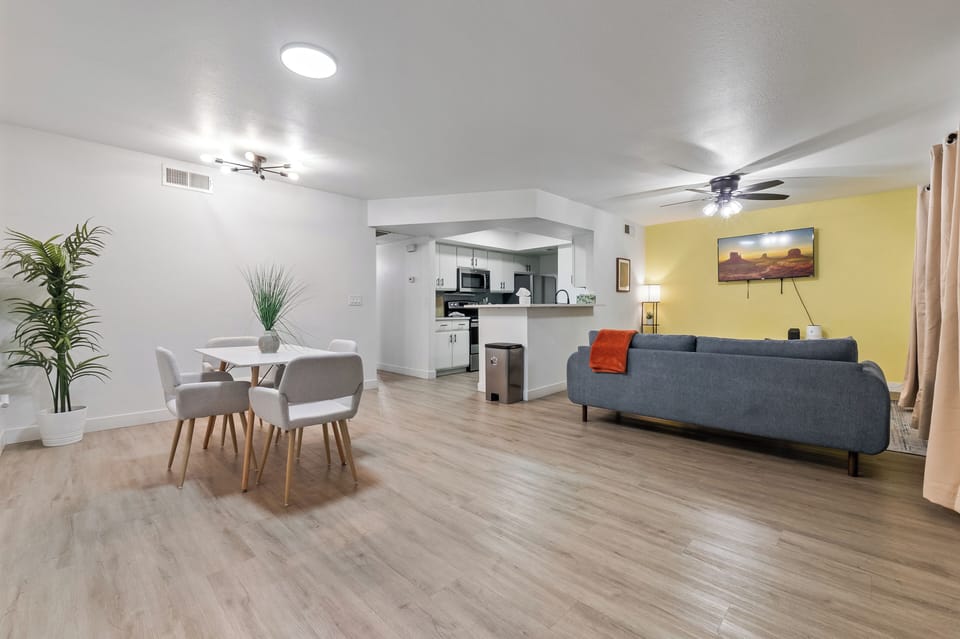 Dining area with seating, connected to kitchen and living room