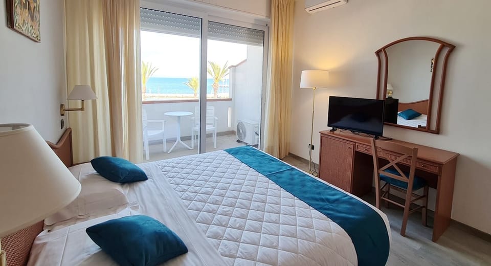 Triple Room, Balcony, Sea View | In-room safe, desk, laptop workspace, soundproofing