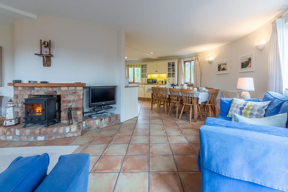 The Little Roundhouse, Polzeath: First floor: Sitting room with wood burning stove