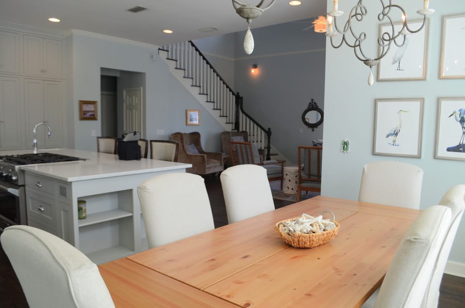 Dining Area Beside the Kitchen Island - The table sits beside the kitchen for easy serving, takeout nights, and meals at home.