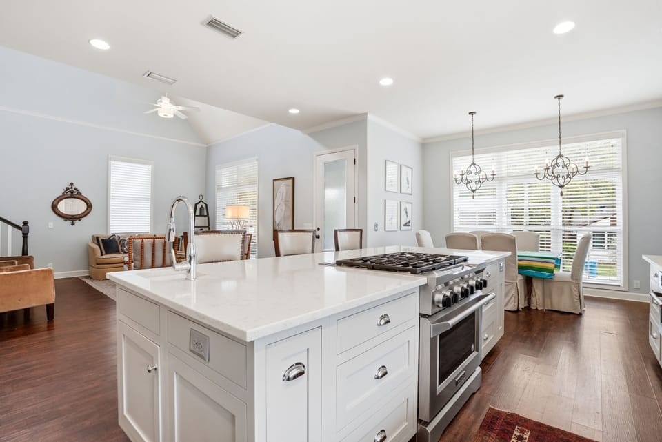 1129 Peachtree - Kitchen Range - Statement range with a custom hood and open sightlines back to the dining area — no shortcuts in this kitchen.