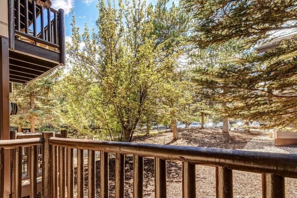 Your private balcony overlooks peaceful trees and natural surroundings, perfect for morning coffee or evening relaxation.