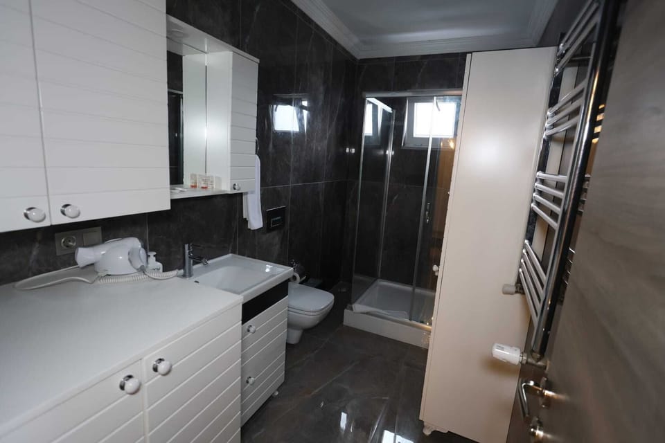 Deluxe Duplex, Balcony, Sea View | Bathroom | Combined shower/tub, hair dryer, slippers, towels