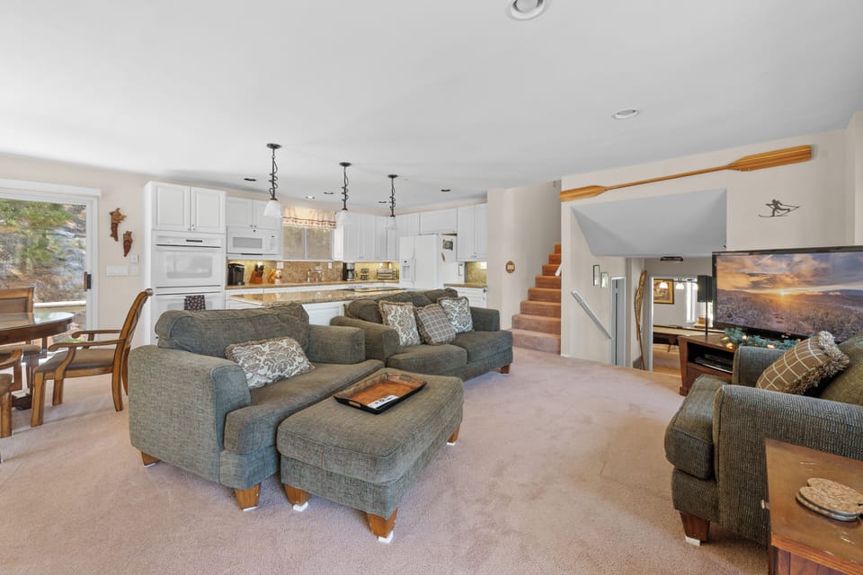 Living Room with Lake Views - Living Room with Lake Views, comfy sweating, open floor plan, patio access, and smart TV!