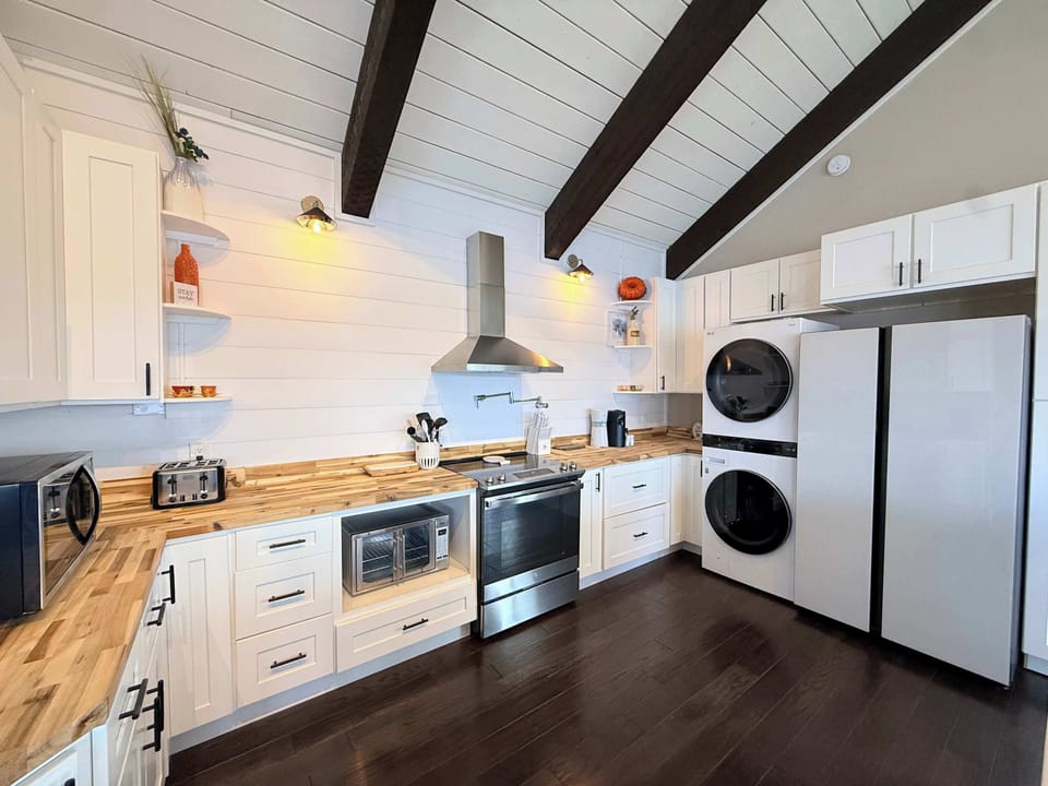 The breezy kitchen offers ample space & all the comforts of home​