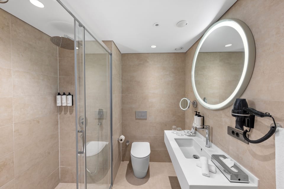 Shower, rainfall showerhead, eco-friendly toiletries, hair dryer