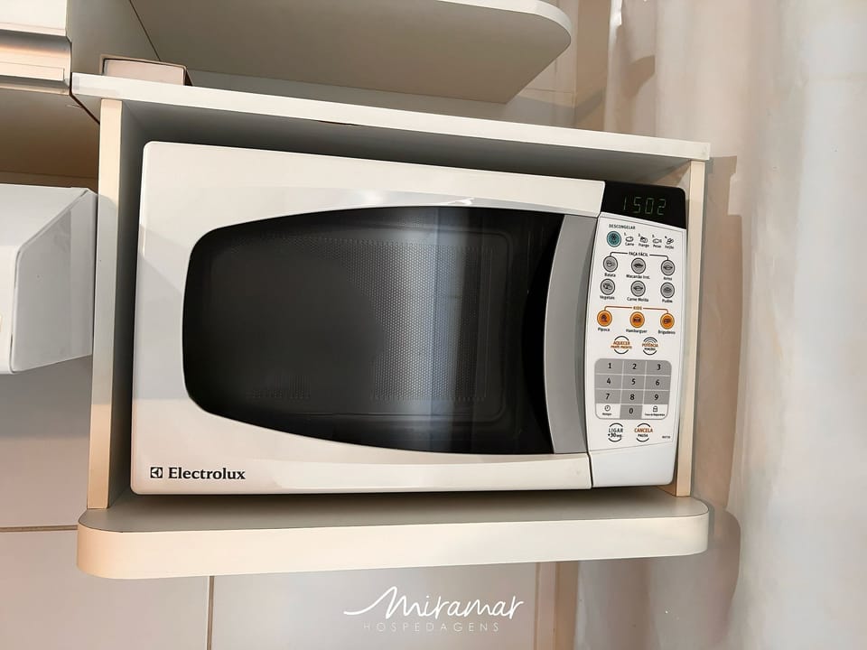 Comfort Apartment | Microwave