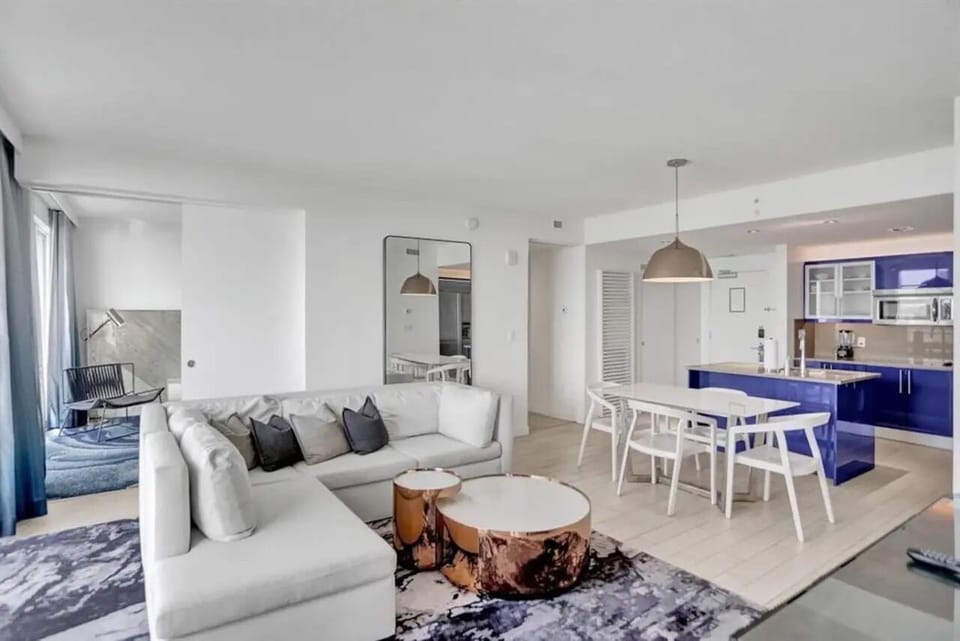 Elegant living space with queen pull-out sofa, designer lighting, and modern finishes, creating a refined and comfortable setting at W Residences Fort Lauderdale Beach.