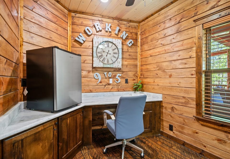 A dedicated workspace provides a quiet corner to catch up on emails or work remotely while still enjoying the cabin setting.