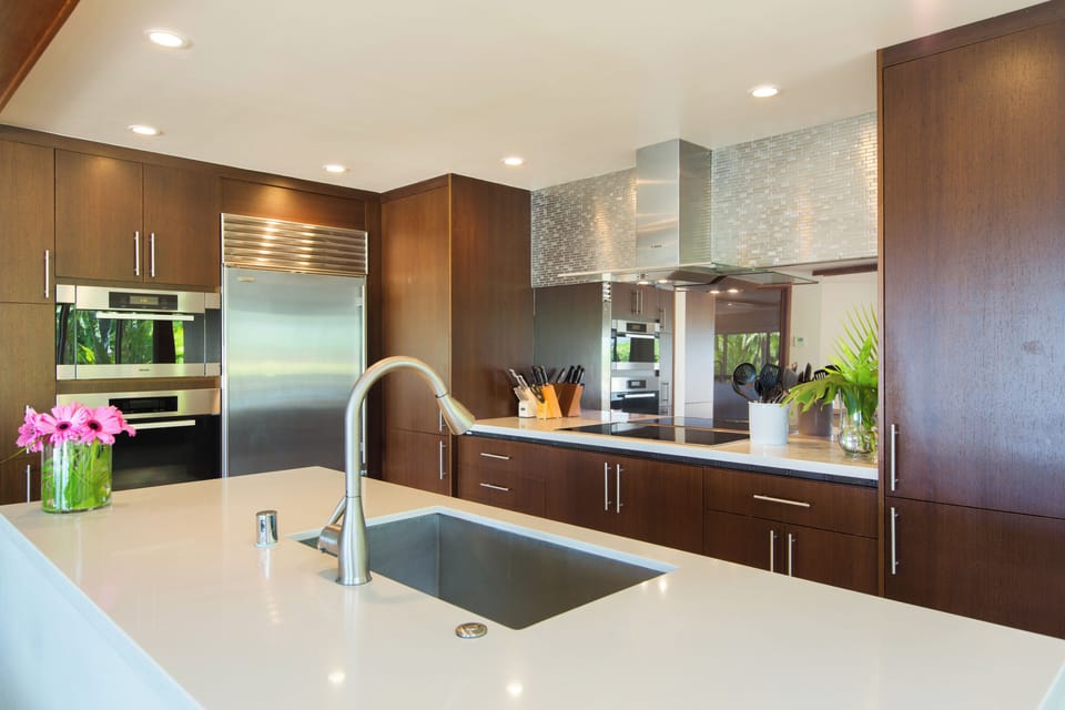 Prepare island-inspired meals in the sleek kitchen with generous counter space.