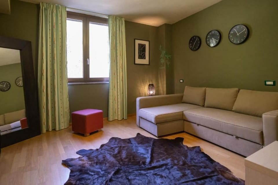Suite, Garden View | Living area | TV, printers