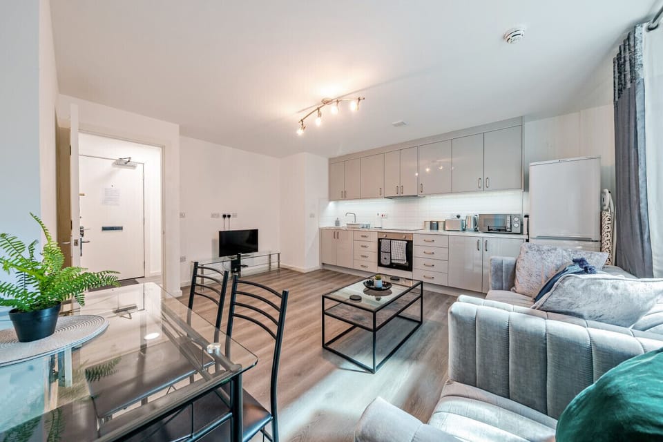 A practical open-plan setup for cooking, dining, and watching TV during your stay.