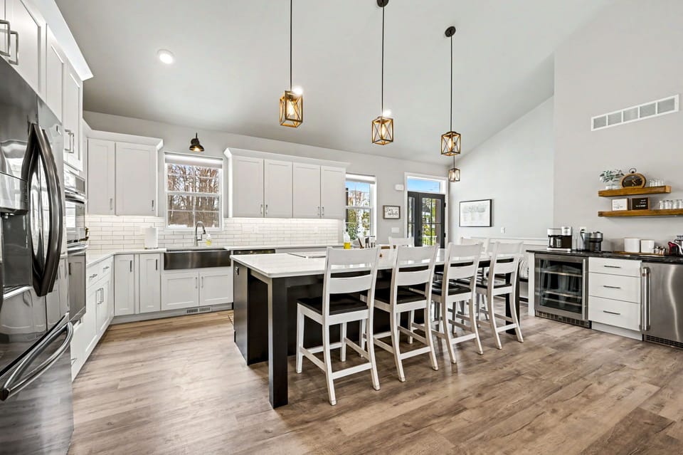 The spacious kitchen features sleek stainless steel appliances, plenty of counter space, and everything you need to prepare meals with ease.