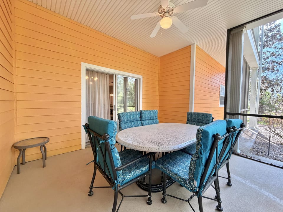 Large covered and screened in patio space.