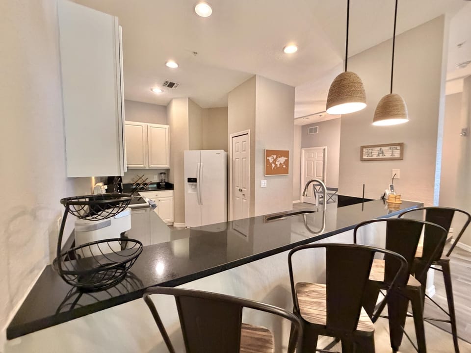 Breakfast bar attached to kitchen.