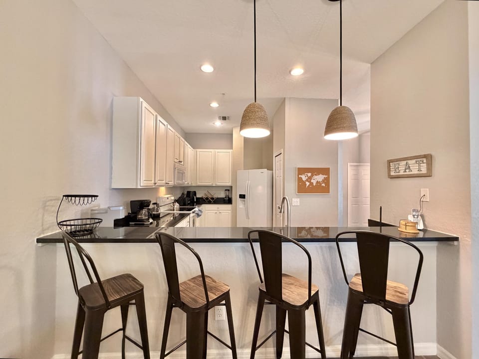 Breakfast bar attached to kitchen.
