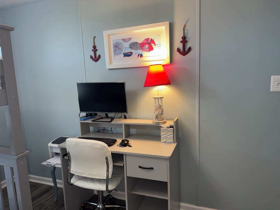 office space in bunk room - w/ desk monitor, keyboard , printer & power strip