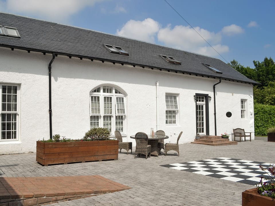 Large patio area with outdoor chess game | The Coach House - Home Farm, Glendaruel