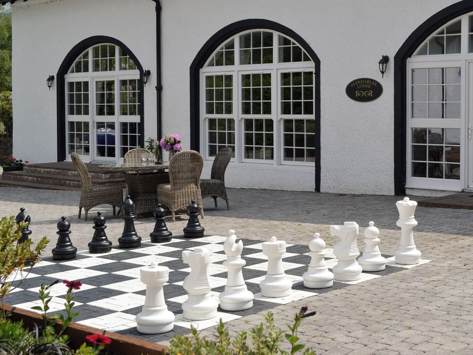 Patio area with oversized chess game | Glendaruel Lodge - Home Farm, Glendaruel