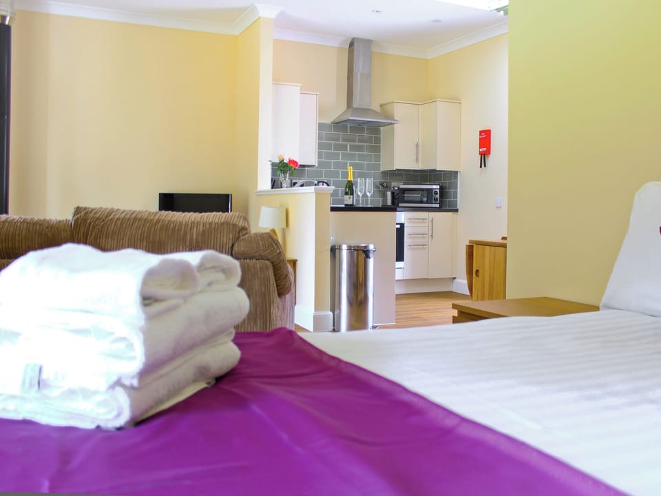 Open plan living/dining room/kitchen/bedroom | Auchendennan - Chestnut Cottage, Arden, Alexandria