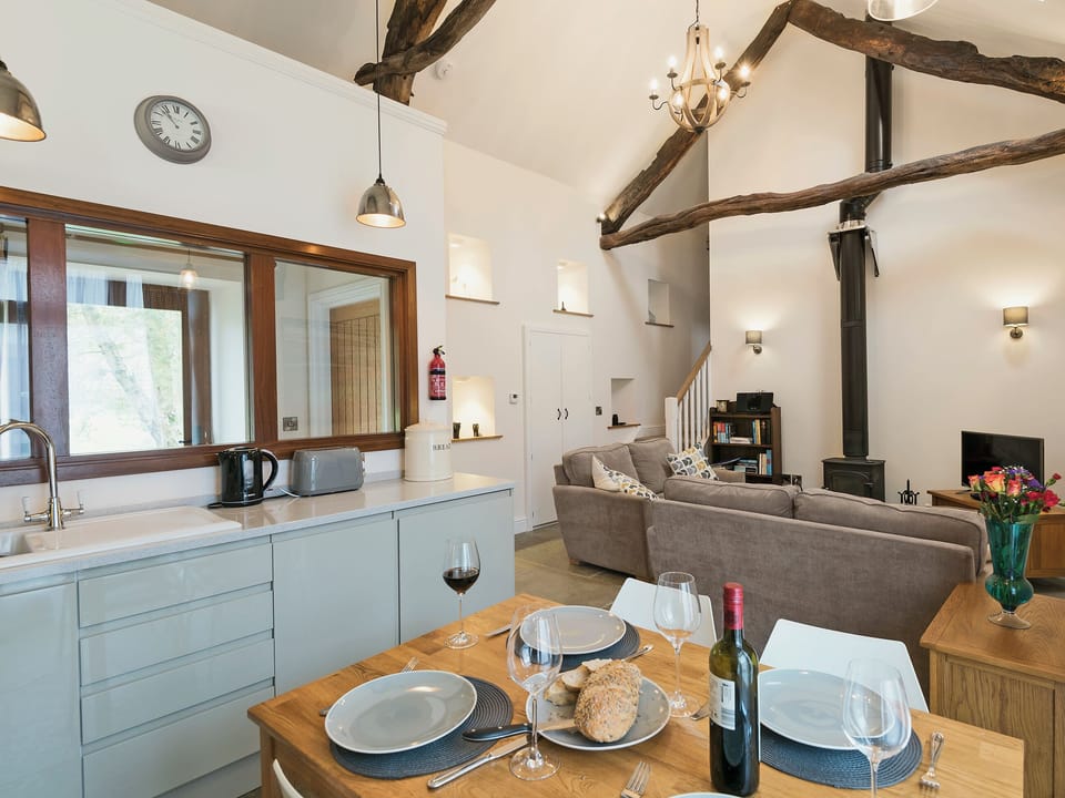 Stylishly converted open plan living space with exposed beams | The Long Barn - Branthwaite Cottages, Branthwaite, near Caldbeck
