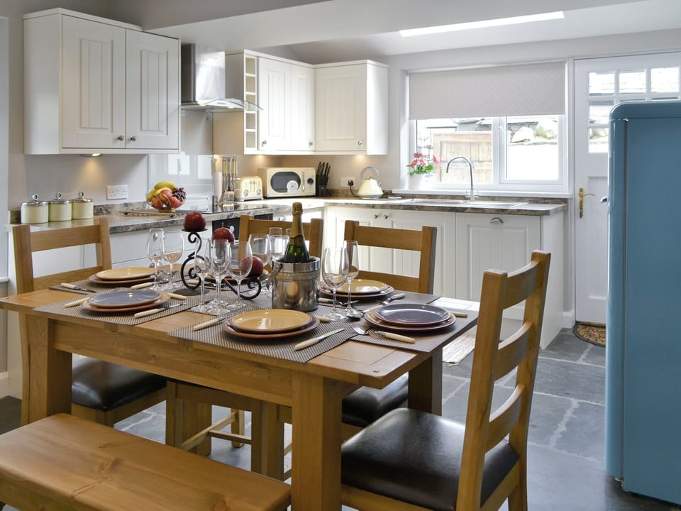 Convenient dining area within kitchen and dining room | Water Howes Cottage, Ambleside
