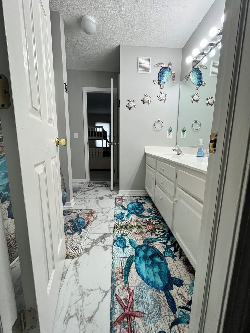 Jack n Jill bathroom connecting bunk room & 2nd bedroom w/ king-sized bed.