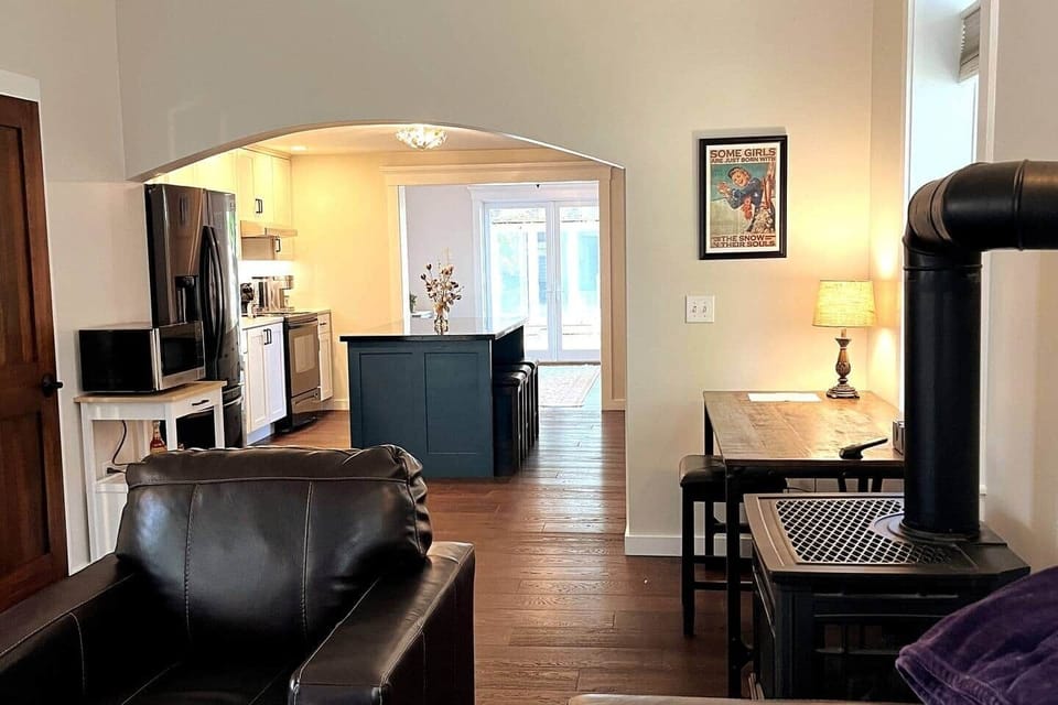 The open floor plan is perfect for family weekends and getaways! Kitchen island dining area connects seamlessly to Living Room area