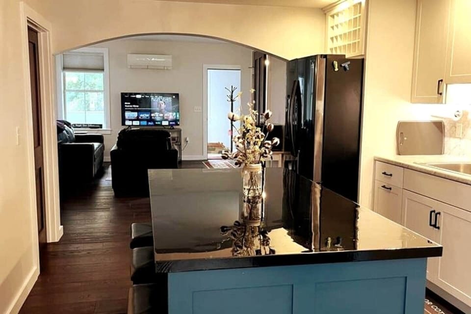 The heart of the home - the kitchen - connects the family room and the living room with a brilliant open floor plan.