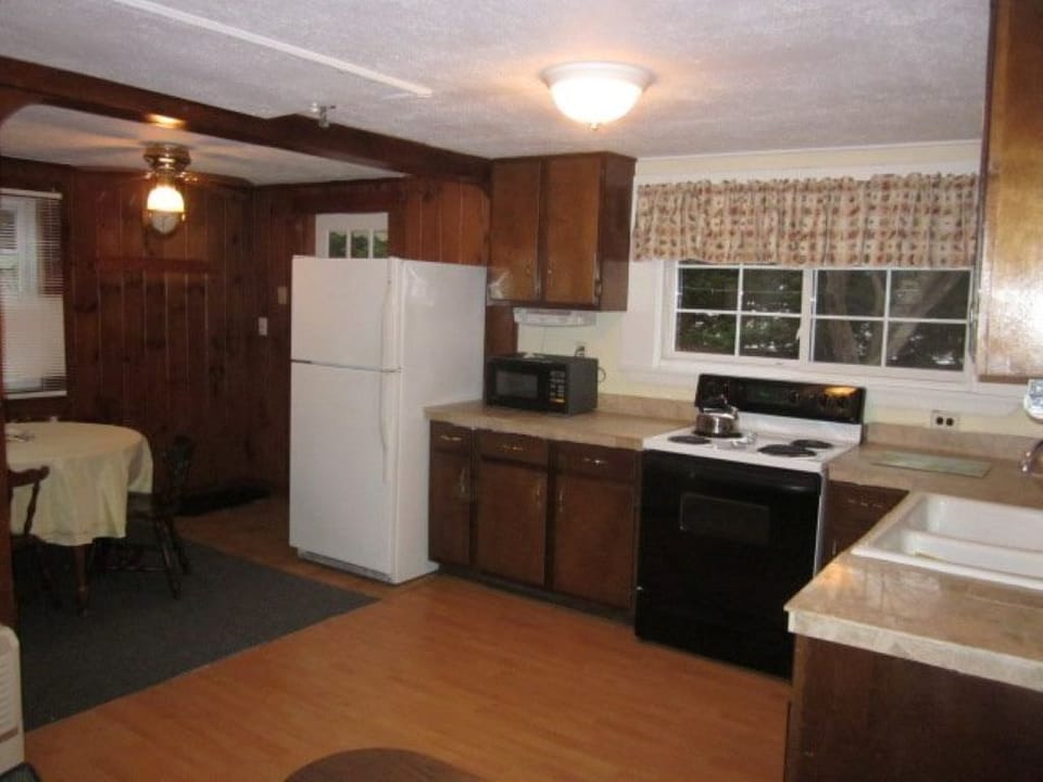 Nice size kitchen with electric stove, plenty of counter and cabinet space.  AC