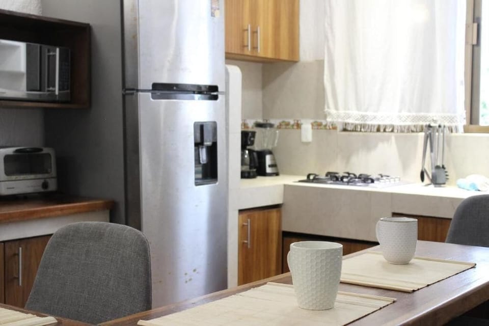 Family House, Balcony, Garden View | Private kitchen | Coffee/tea maker, toaster, dining table