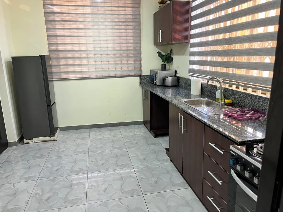 Full kitchen with refrigerator