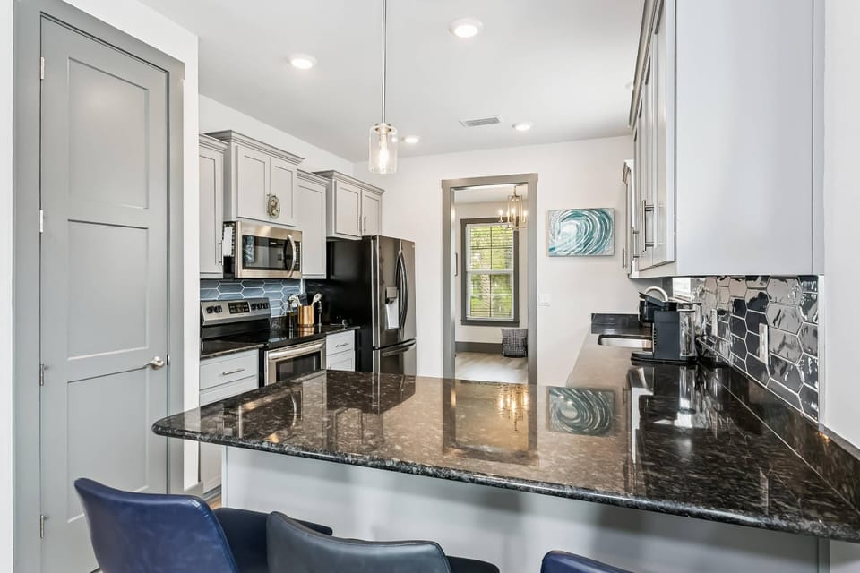 Beautiful kitchen with granite counters and tile backsplash