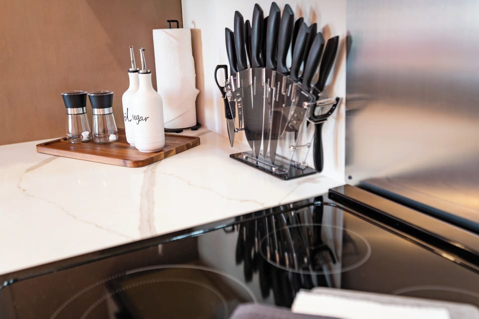 Clean cooking area with knives and stovetop setup
