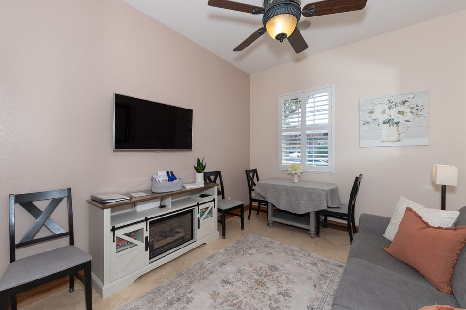 Comfortable living area with sofa, dining space, and natural light