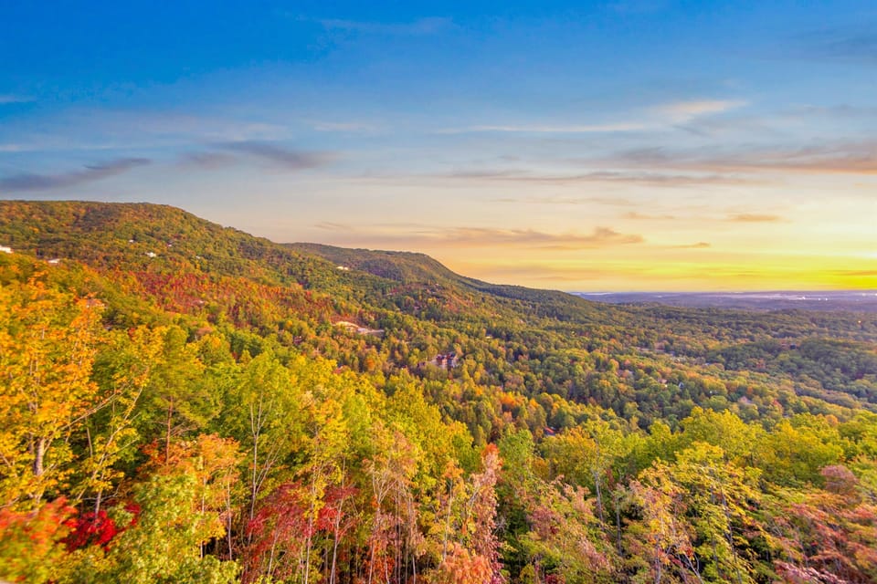 Stunning aerial view showcasing the cabin’s mountain setting.