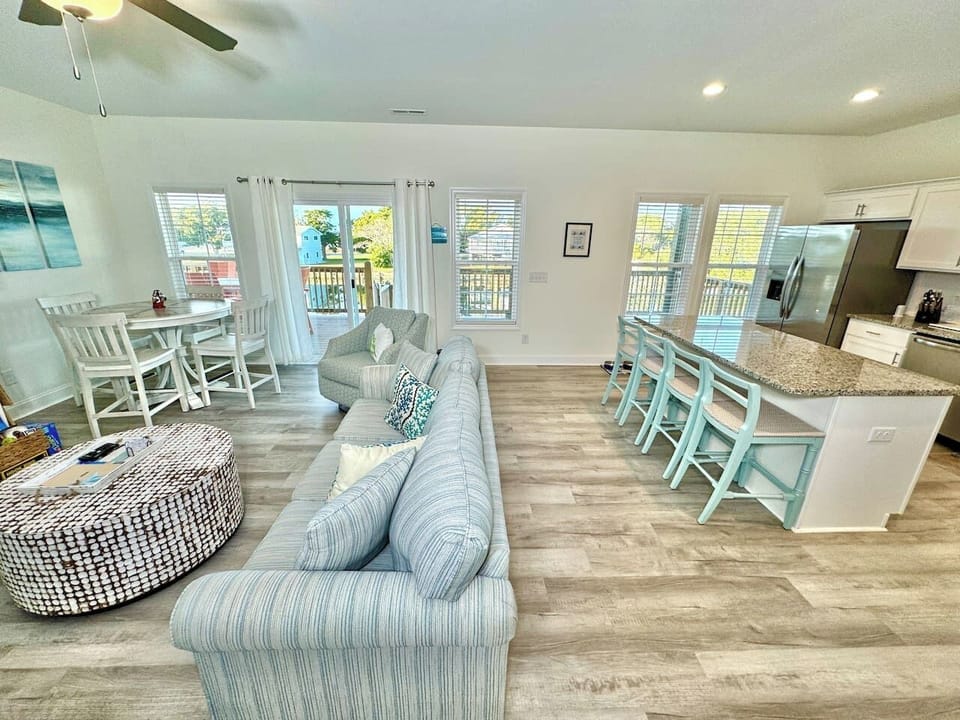 Get cozy while you relax in this living room with a fireplace and water view. Sofa bed features a Queen mattress. 