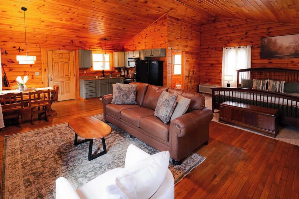 Living Room: Bright wood accents and plush seating create a perfect hangout for your getaway!