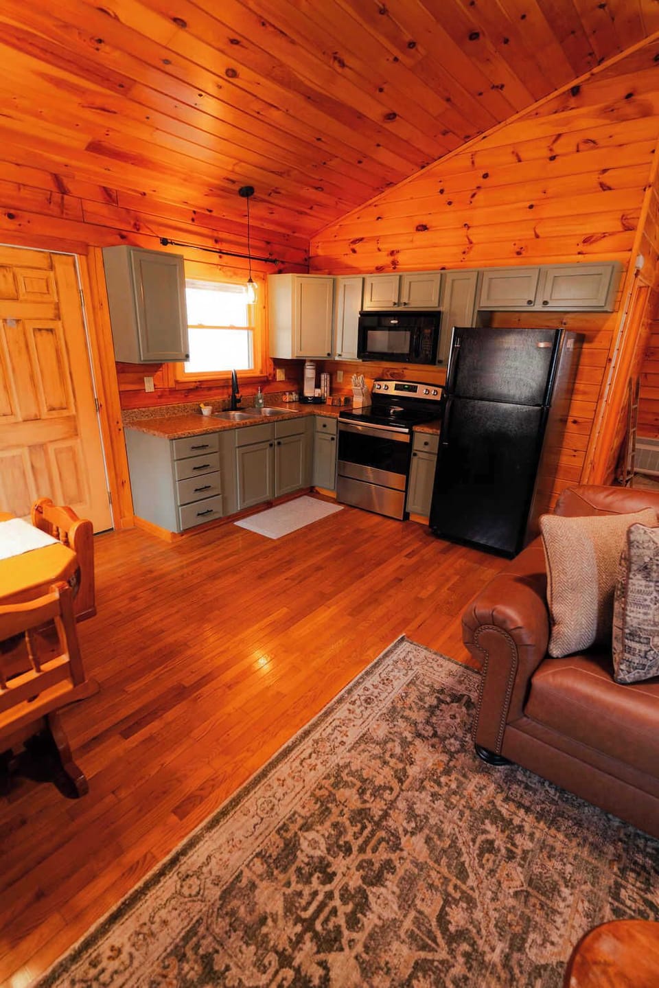 Charming Kitchen: Light-filled space with modern appliances and rustic wood accents awaits your culinary adventures!