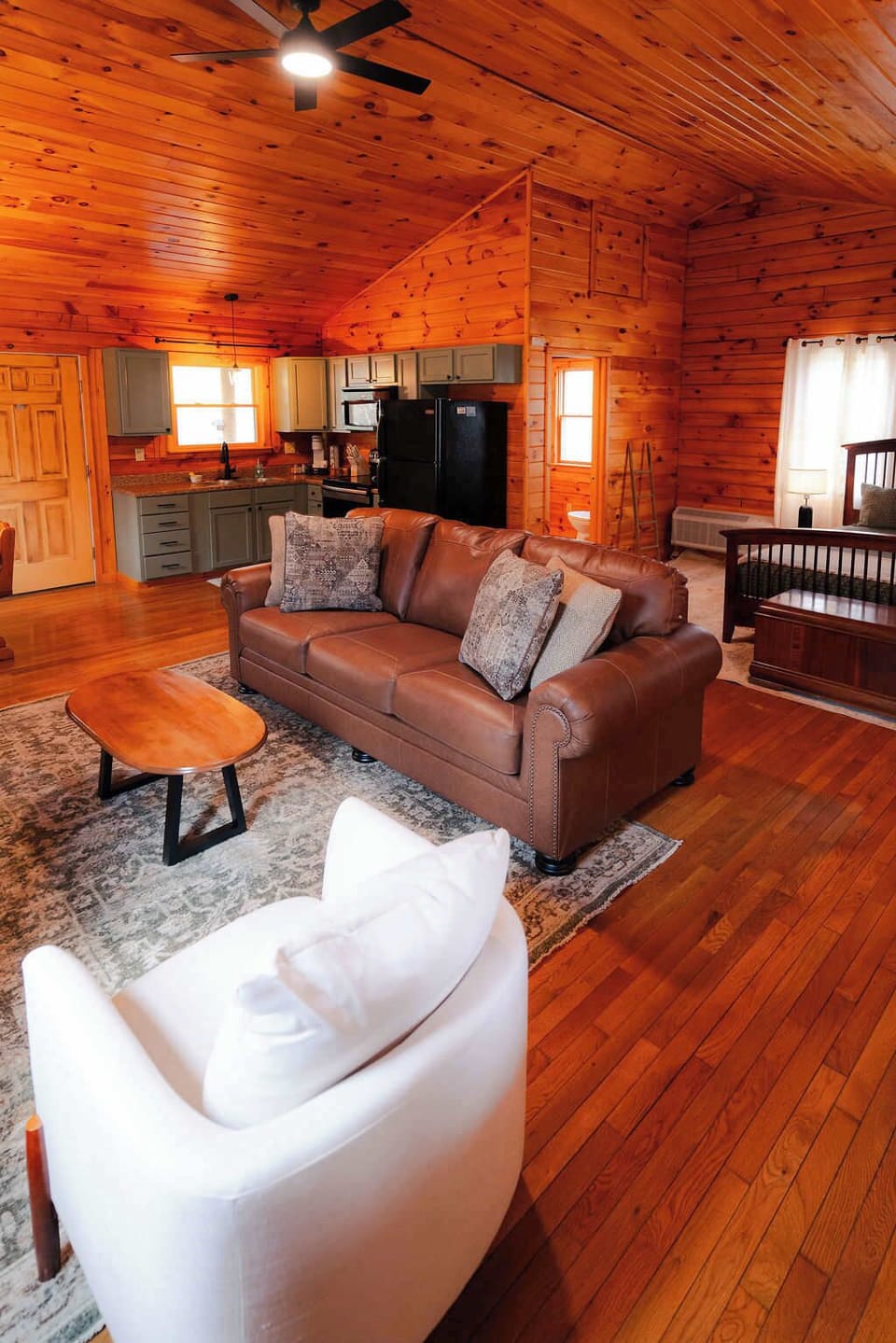 Living Room: Rustic charm meets modern comfort in this sunlit, open space for relaxation.