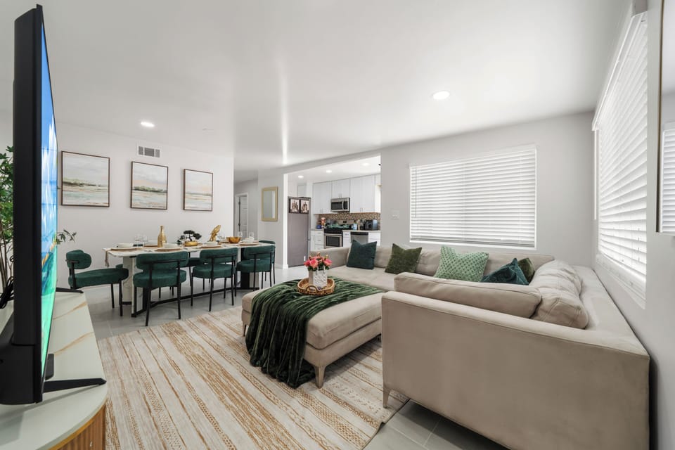 Bright living room with open layout and comfortable seating.