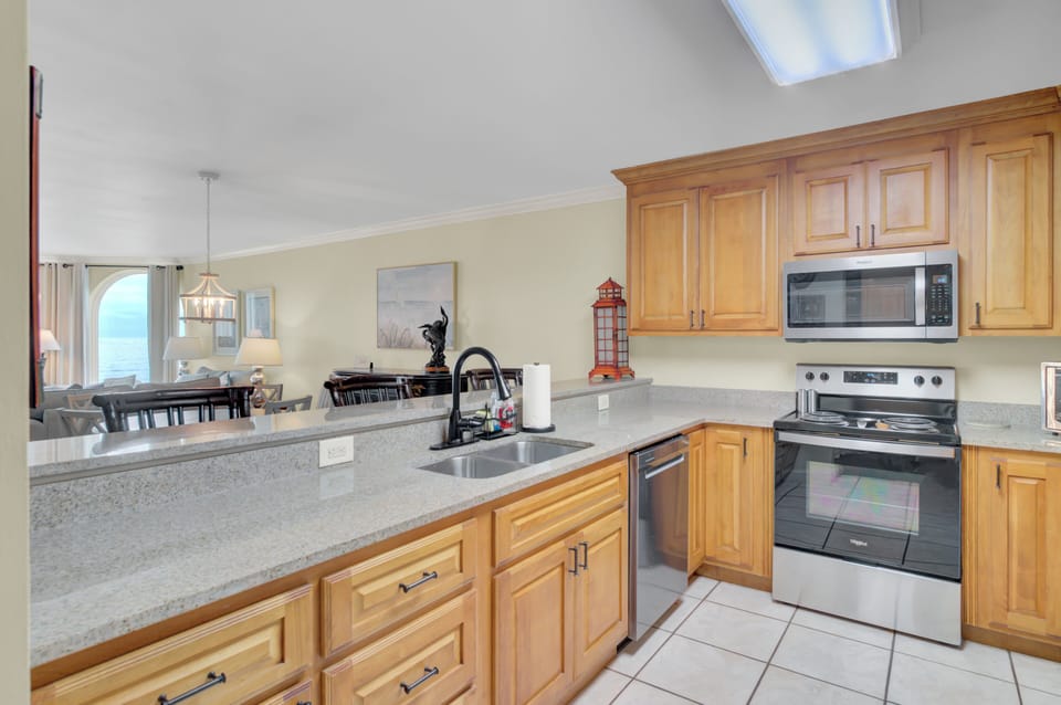 Modern kitchen with stainless sink and prep space.